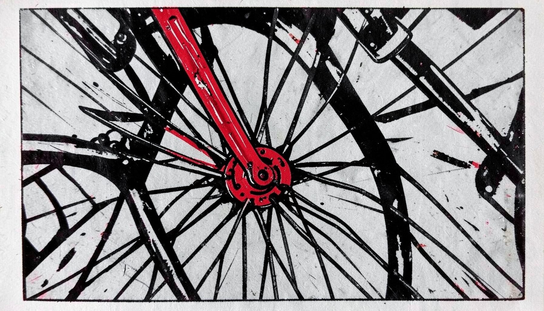 A carved linocut relief print of a close-up bicycle wheel and fork, strong black lines against a pale grey background, with subtle red accents on the hub, evoking precision and craftsmanship.
